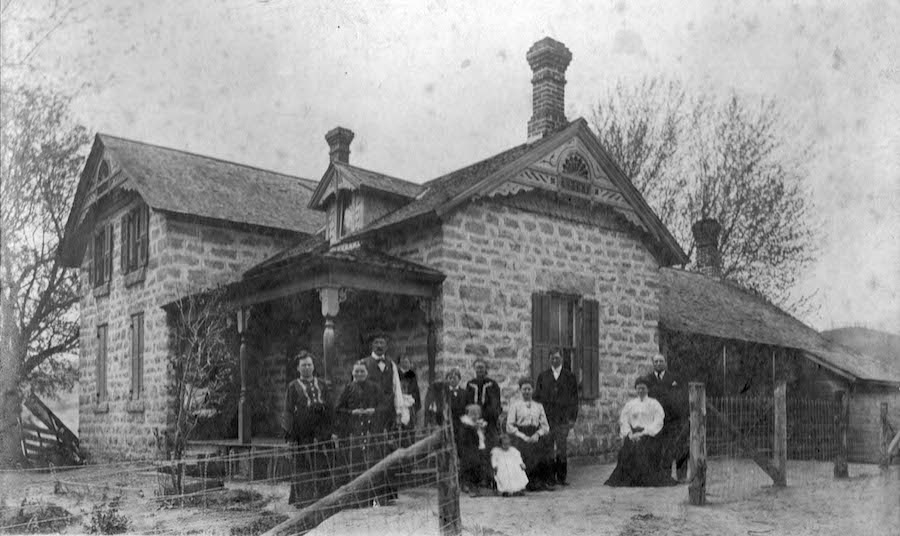 The Pellowskis, ca. 1905. Leokadia is in a black dress with white trim, standing to the right of the porch.